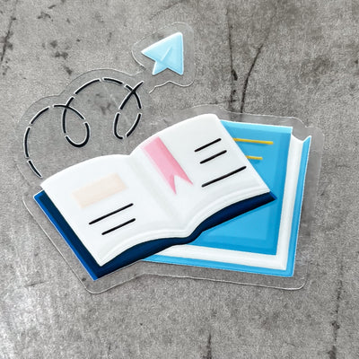 Blue books vinyl sticker, offered in classic white with white background and white border or clear sticker with a solid white backing, but is clear once the backing is removed. School vinyl stickers by Simpliday Paper by Olga Nagorna.