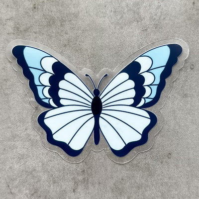 Clear blue butterfly vinyl sticker by Simpliday Paper by Olga Nagorna comes with a solid white backing, but is clear once the backing is removed.