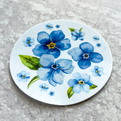 Forget-me-not florals vinyl sticker by Simpliday Paper by Olga Nagorna comes with a solid white backing. Can be used on mobile phones, water bottles, cups, binders, notebooks and more.