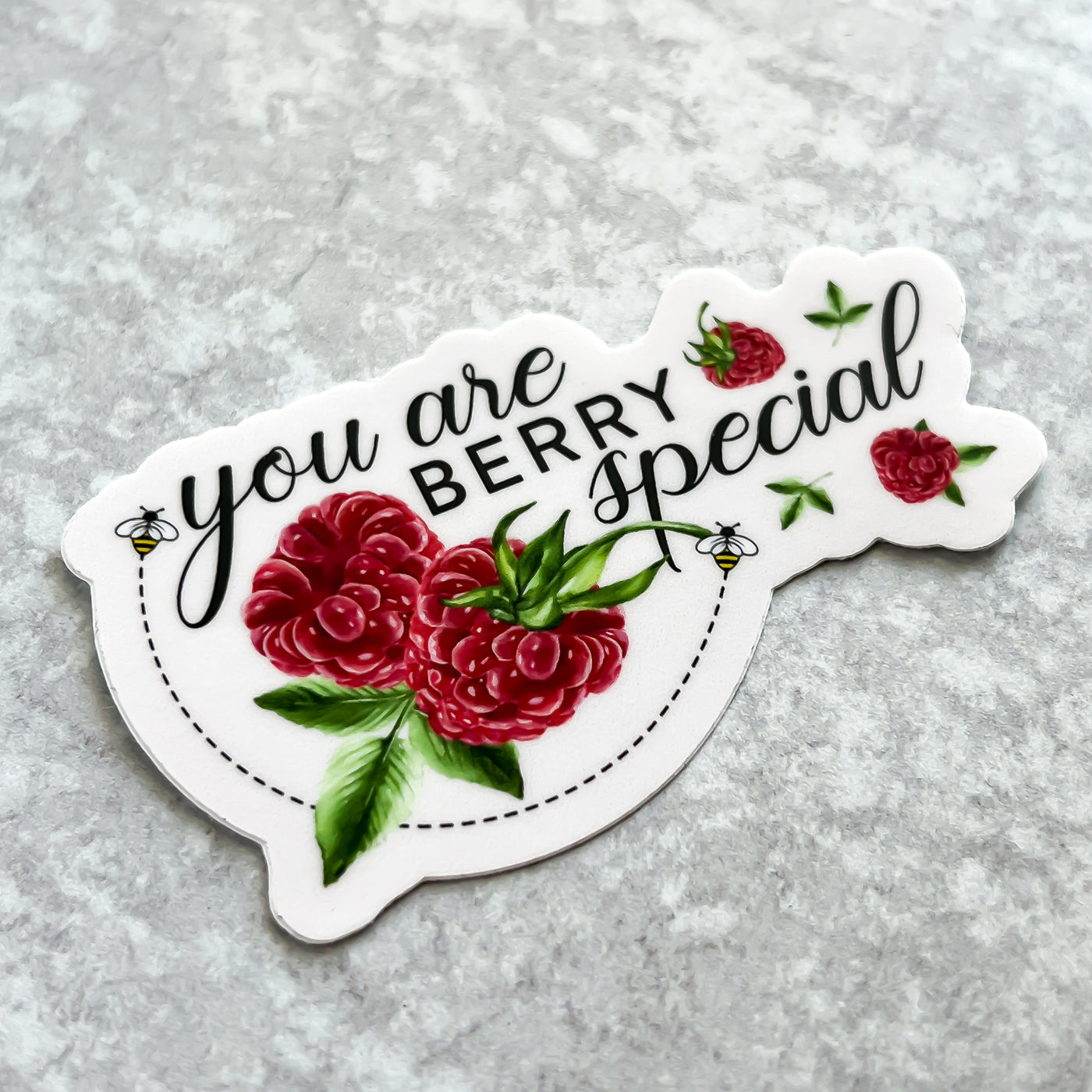 Raspberries and bees vinyl sticker comes with a solid white backing. Can be used on mobile phones, water bottles, cups, binders, notebooks and more. By Simpliday Paper by Olga Nagorna