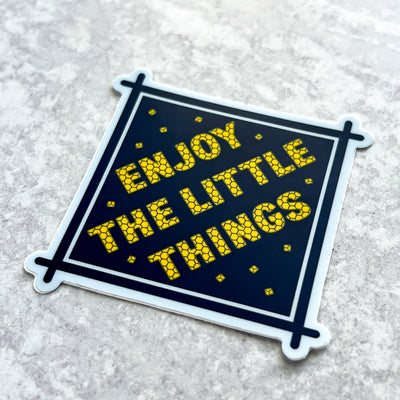 Navy and yellow Enjoy the Little things die cut vinyl sticker comes with a solid white backing. Can be used on mobile phones, water bottles, cups, binders, notebooks and more. Simpliday Paper by Olga Nagorna