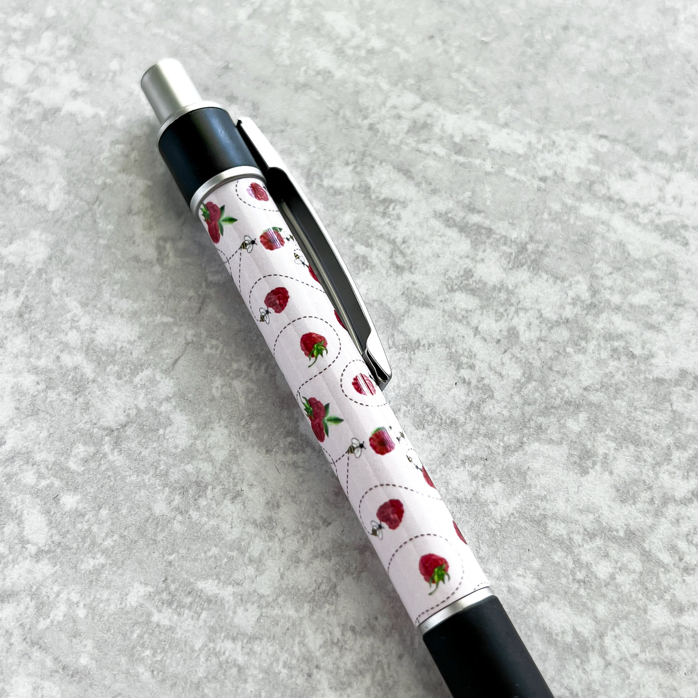 Our beautiful Raspberry Bee Pen is the perfect companion for your Simpliday Paper notebooks and notepads and a staple for your desk or purse. This premium ballpoint pen features Simpliday Paper artwork that wraps entirely around the pen.&nbsp;