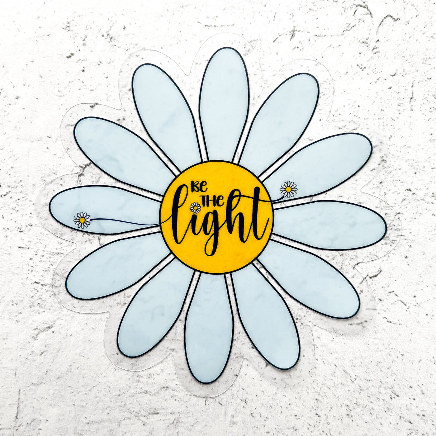 Be the Light clear vinyl blue daisy sticker by Simpliday Paper, Olga Nagorna.