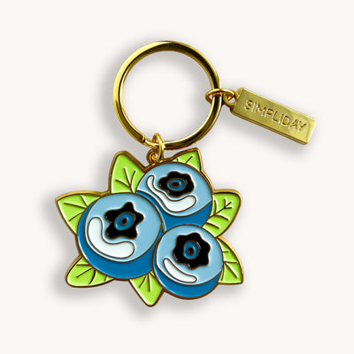 Garden blueberries metal keychain is made out of hard enamel, filled and sealed. Each one is durable and waterproof. The back side of keychain features a word "GOODNESS" on solid gold background, that can work as a tiny mirror.